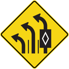 Lane Direction Control Ahead sign (with the voided lozenge indicating a reserved lane)